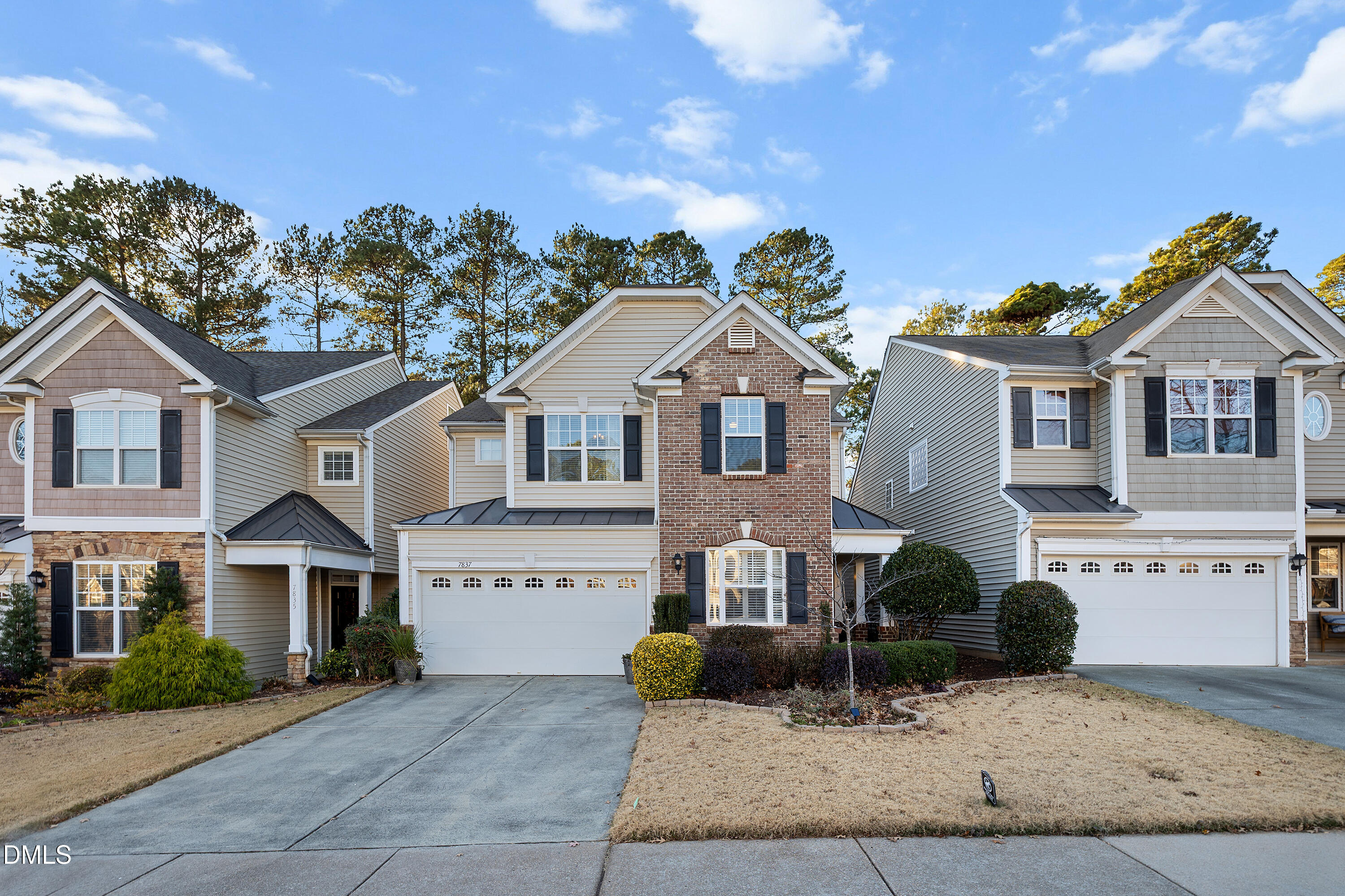 7837 Cape Charles Drive Raleigh, NC 27617 - Photo 2 of 43 a front view of a house with a yard and garage
