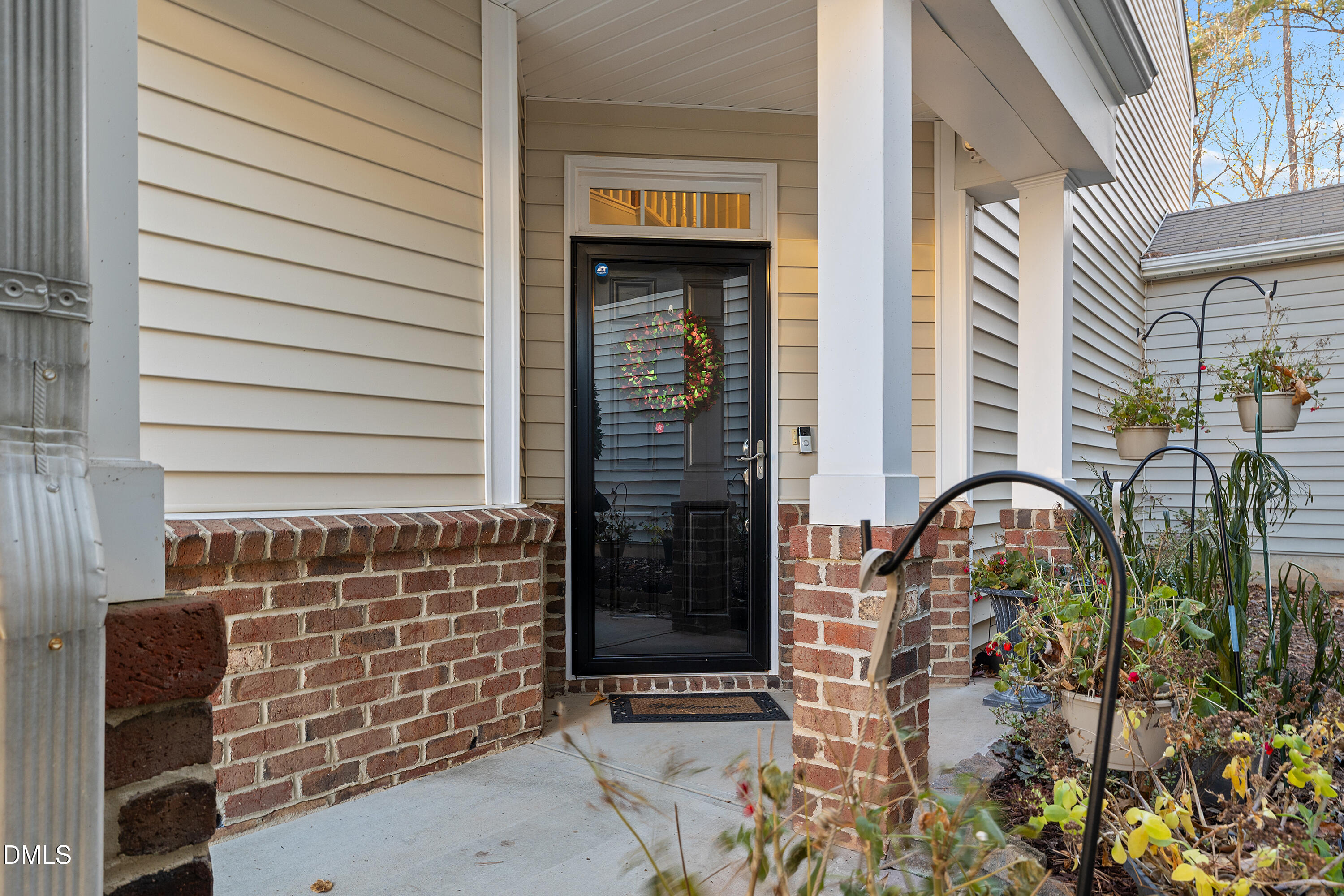 7837 Cape Charles Drive Raleigh, NC 27617 - Photo 2 of 44 a couple of potted plants in front of door