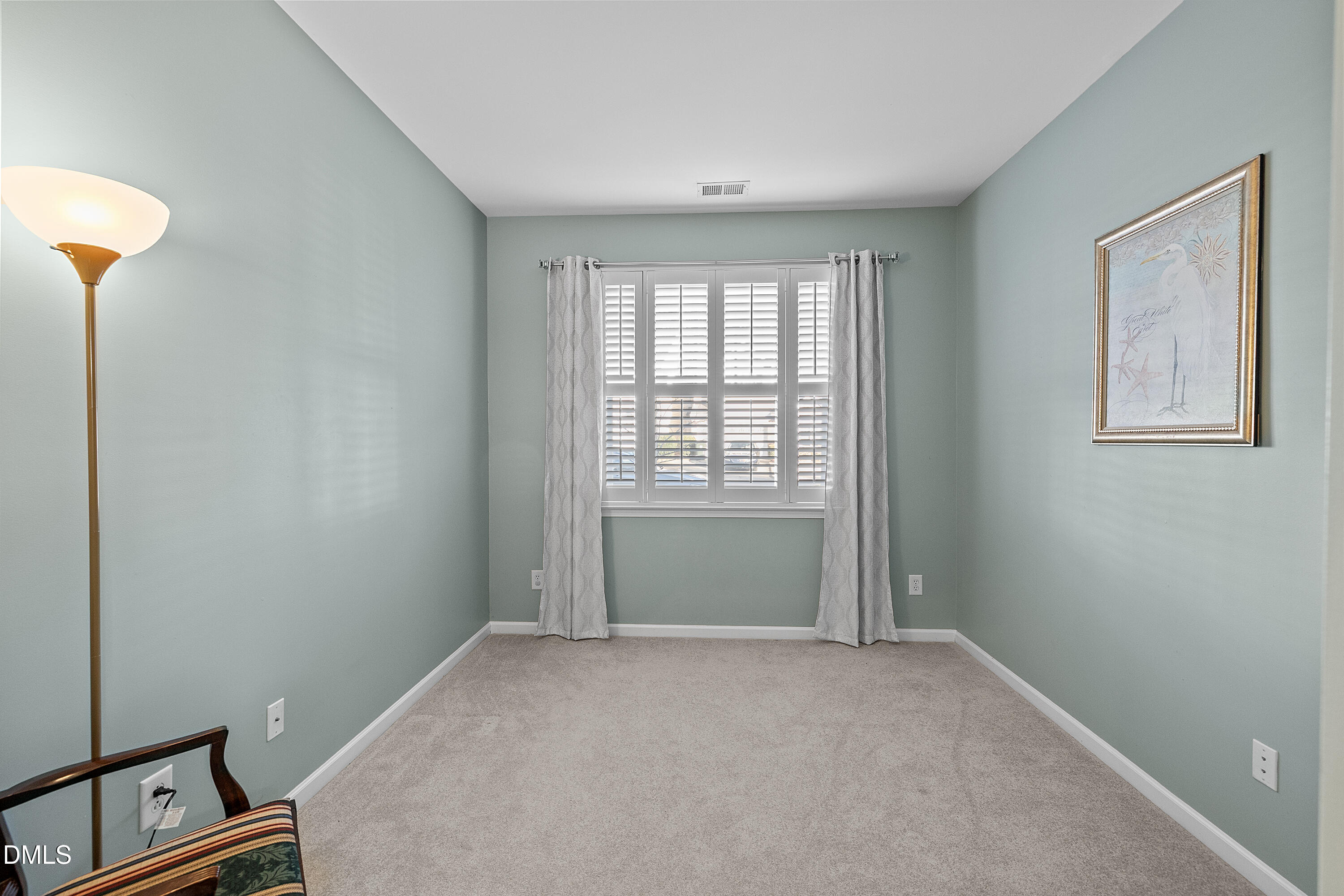 7837 Cape Charles Drive Raleigh, NC 27617 - Photo 31 of 43 a view of an empty room with a window