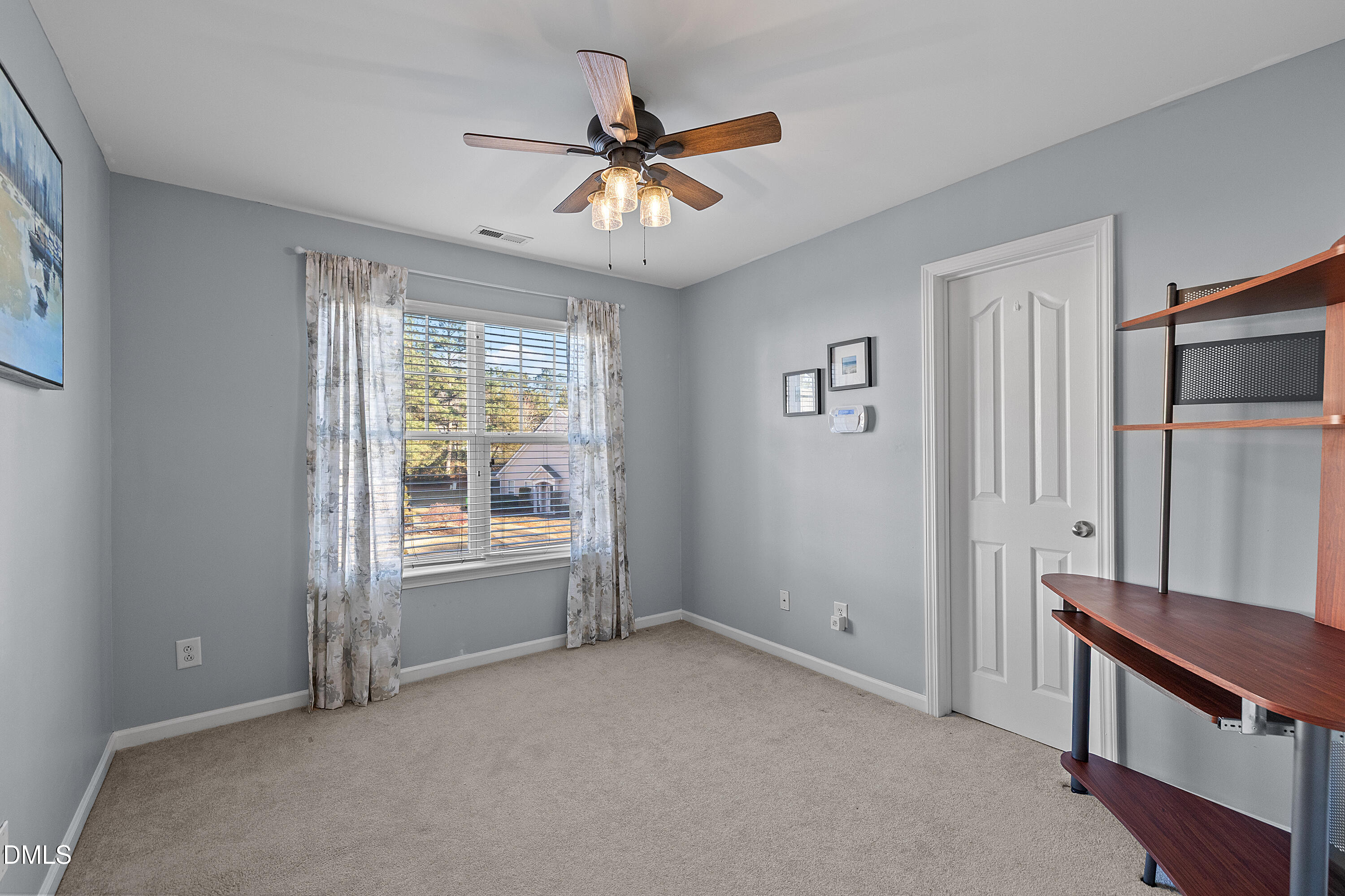 7837 Cape Charles Drive Raleigh, NC 27617 - Photo 32 of 43 a view of an empty room with a window