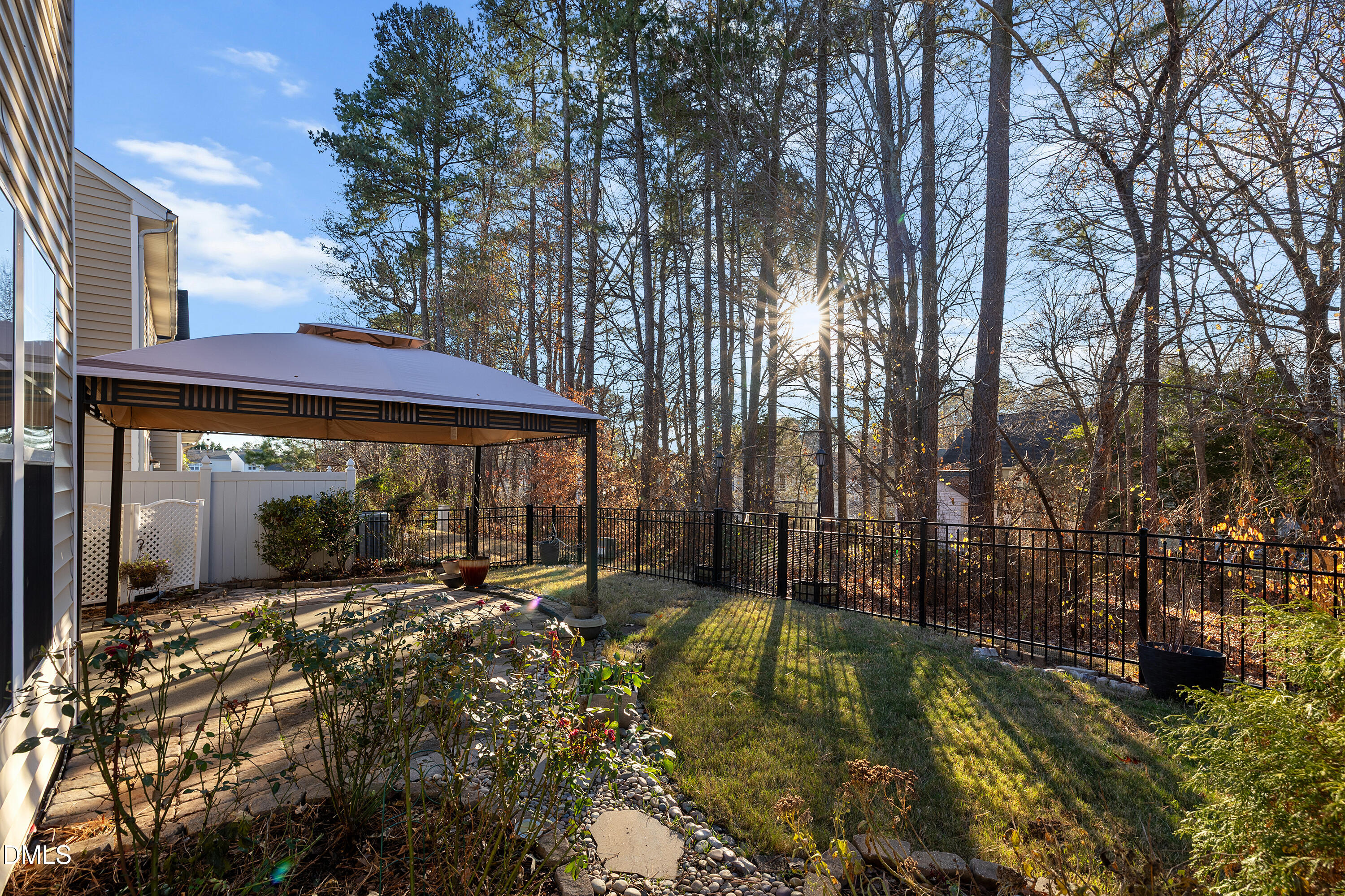 7837 Cape Charles Drive Raleigh, NC 27617 - Photo 35 of 44 a view of a house with a large tree and yard