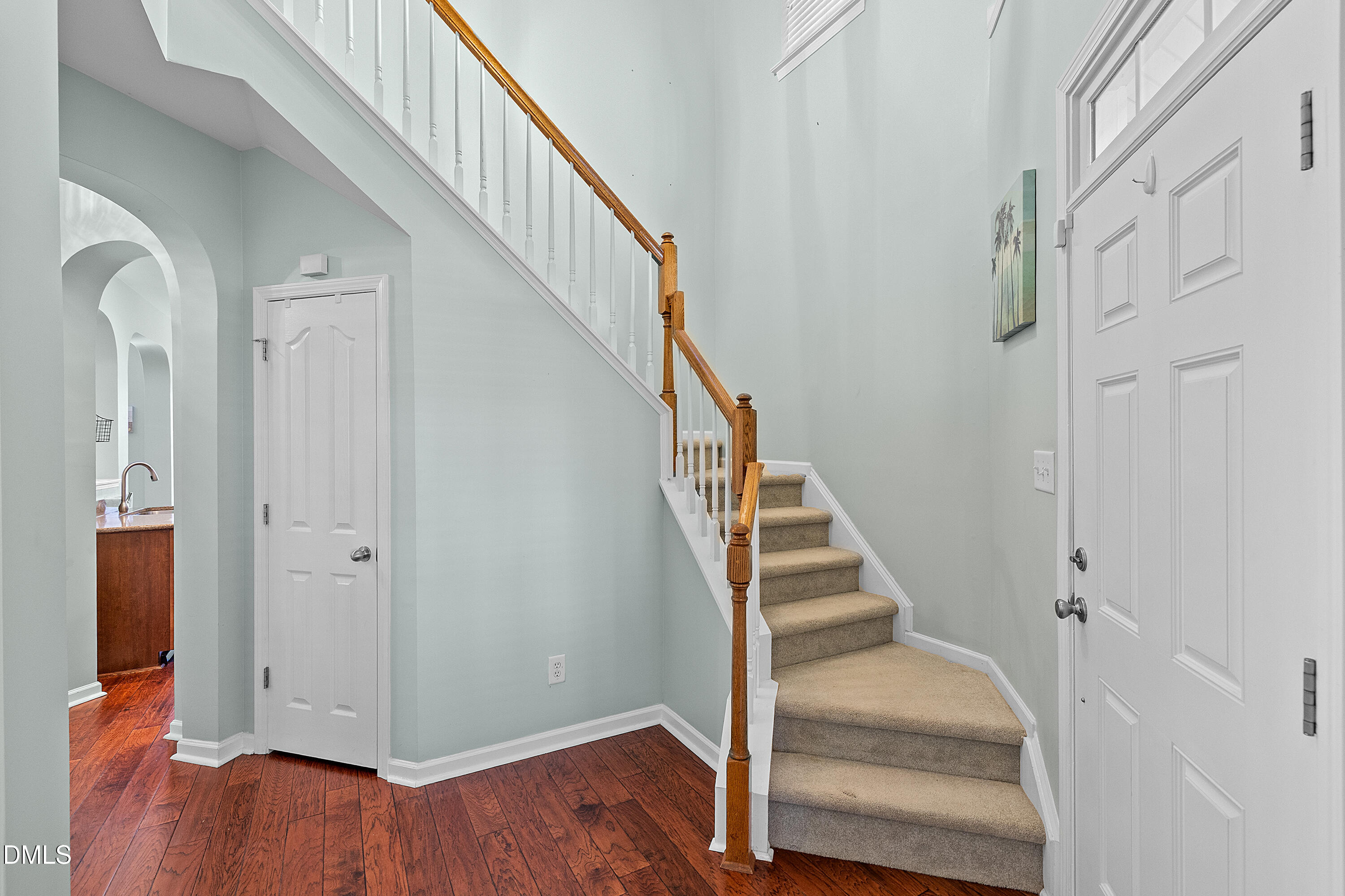 7837 Cape Charles Drive Raleigh, NC 27617 - Photo 5 of 43 a view of entryway with wooden floor and stairs