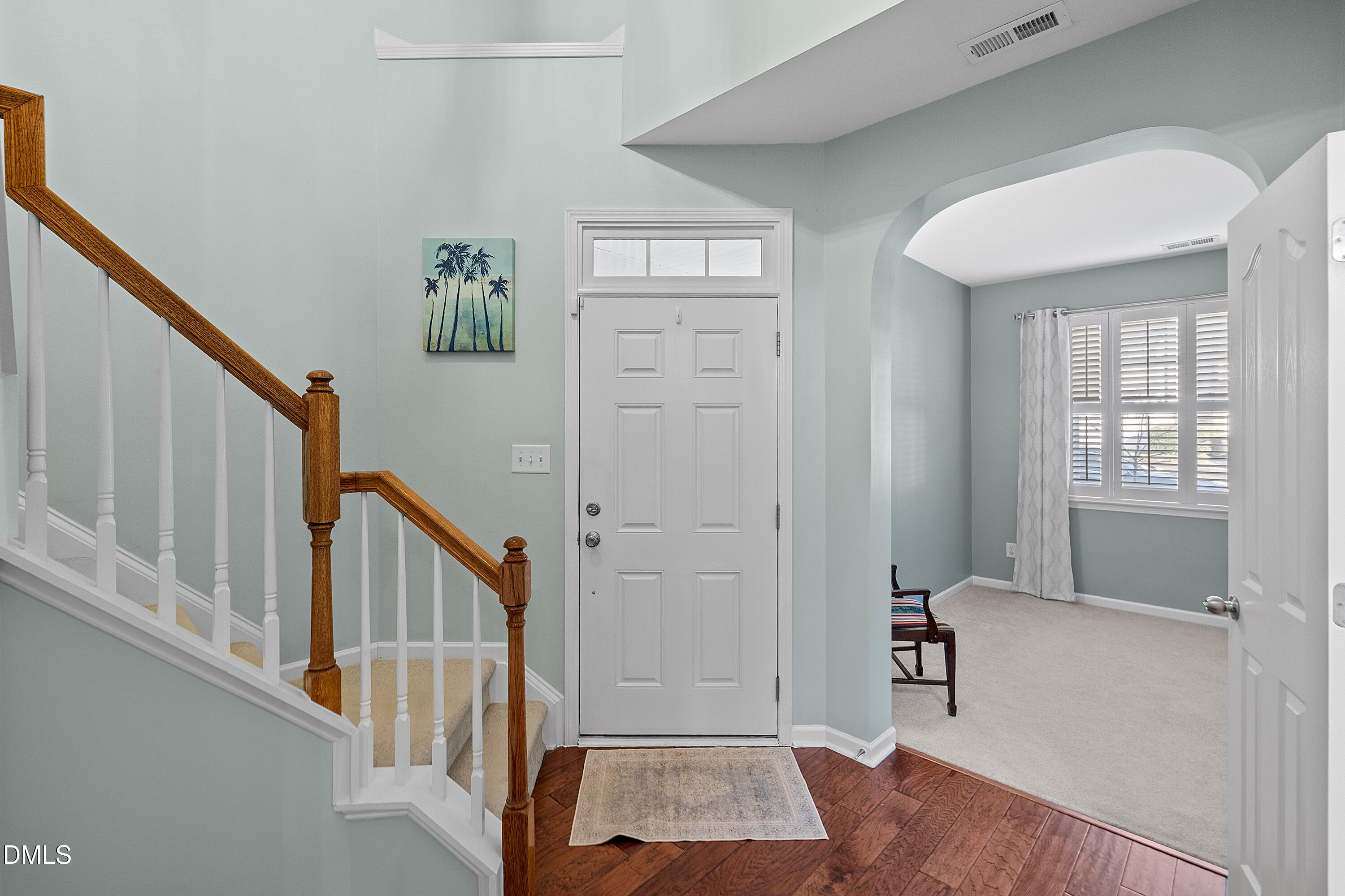 7837 Cape Charles Drive Raleigh, NC 27617 - Photo 6 of 43 a view of entryway with a window and wooden floor