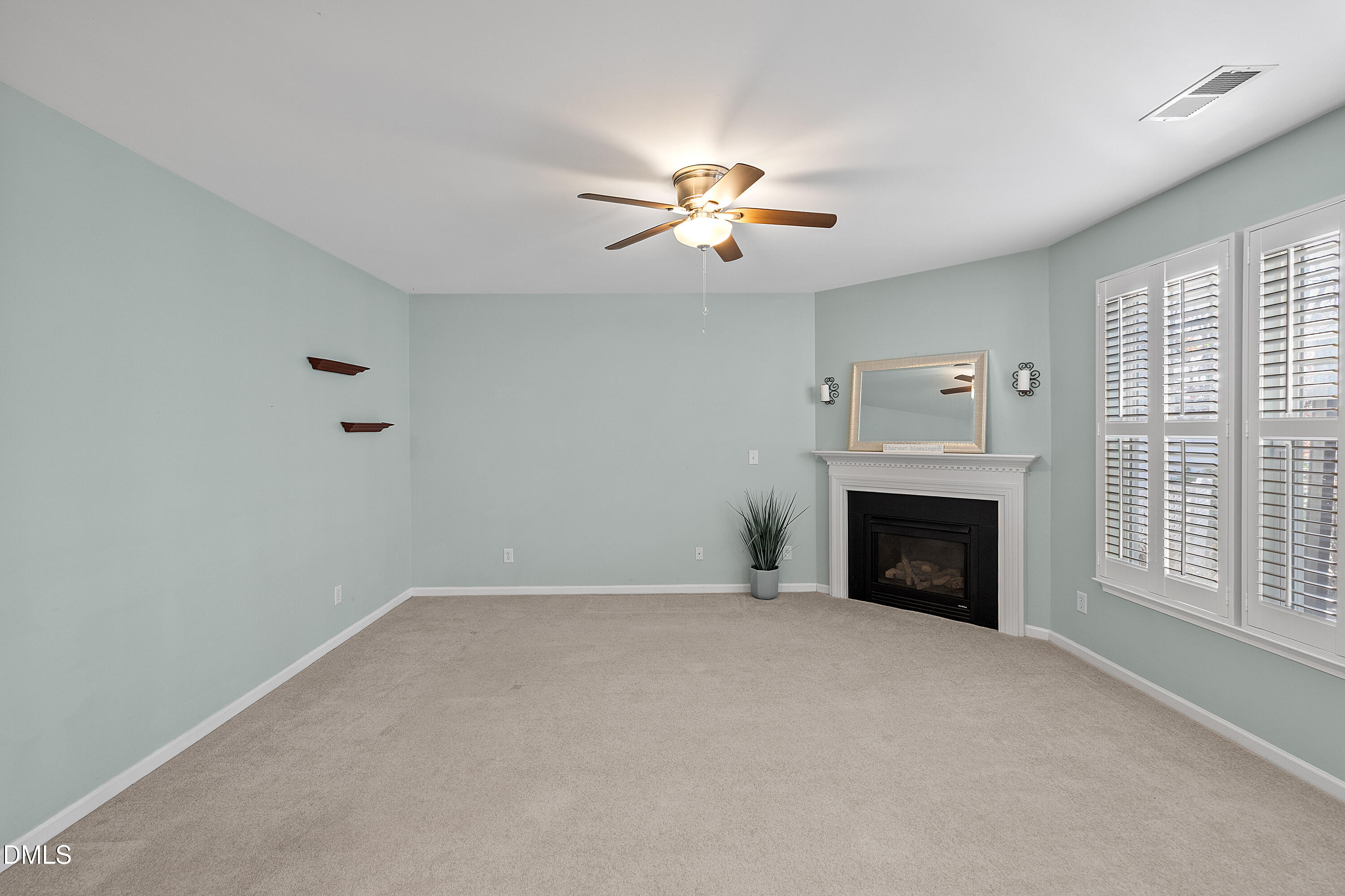 7837 Cape Charles Drive Raleigh, NC 27617 - Photo 8 of 43 a view of empty room with a fireplace