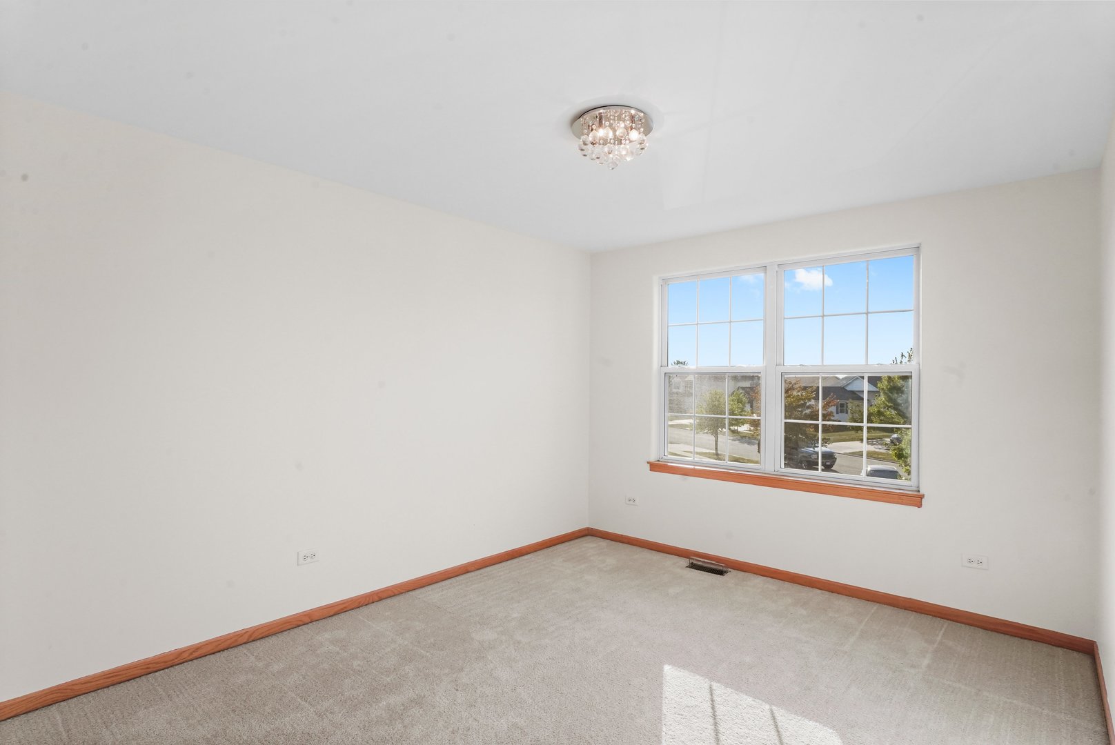 1514 Spring Oaks Drive Joliet, IL 60431 - Photo 18 of 35 a view of an empty room with a window