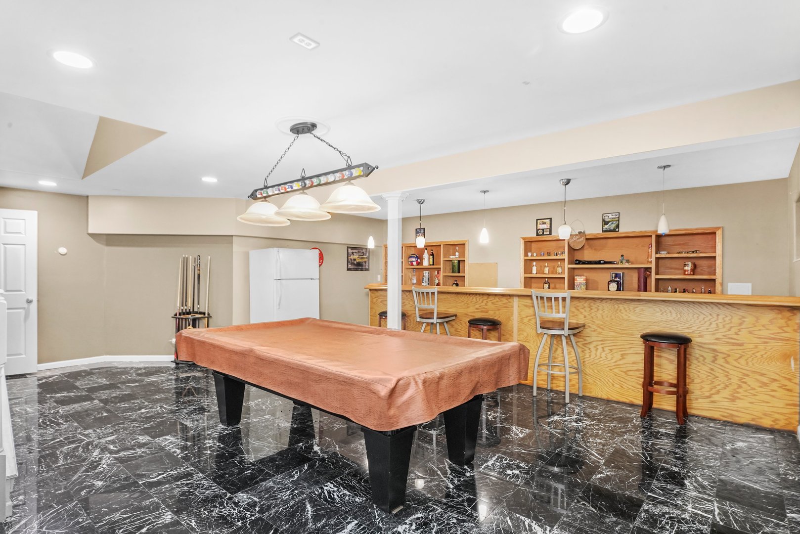 1514 Spring Oaks Drive Joliet, IL 60431 - Photo 21 of 35 a kitchen with stainless steel appliances a table chairs and microwave
