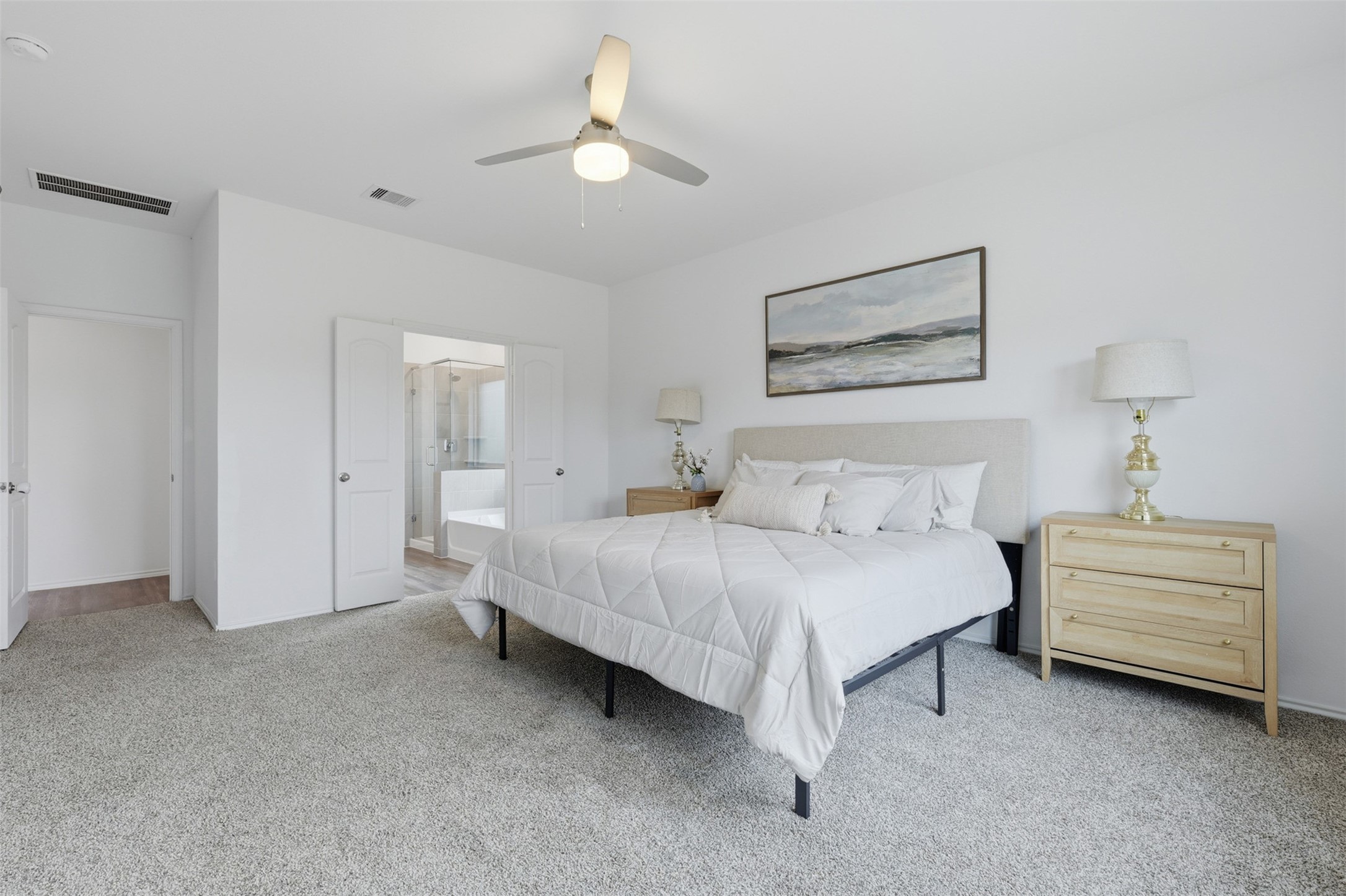 17719 Winfall Drive Crosby, TX 77532 - Photo 19 of 47 This spacious primary bedroom features neutral tones, plush carpeting, and a ceiling fan.