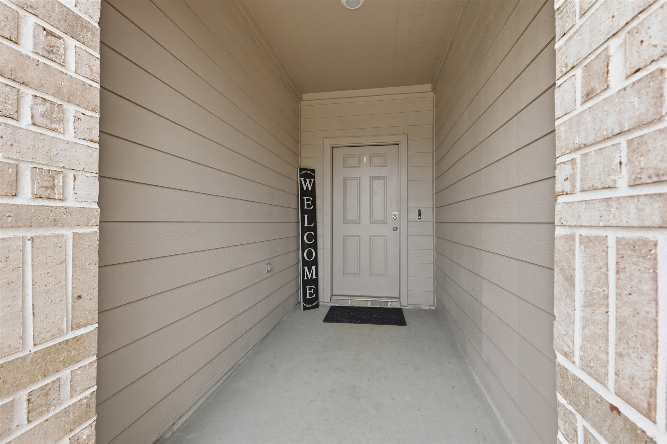 17719 Winfall Drive Crosby, TX 77532 - Photo 35 of 47 This photo shows a welcoming front entrance with neutral siding and a brick exterior. The entrance features a solid front door.