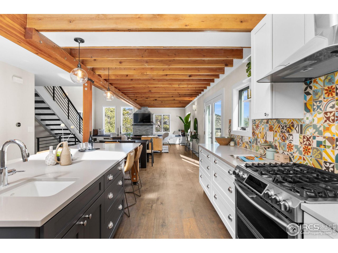 1346 Deer Trail Road Boulder, CO 80302 - Photo 40 of 40 a kitchen with sink stove and cabinets