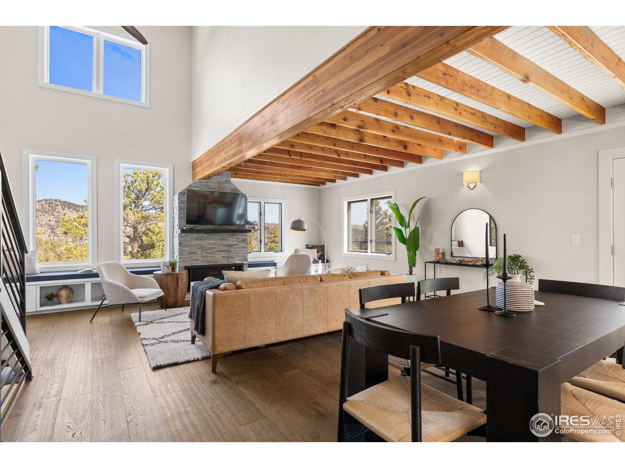 1346 Deer Trail Road Boulder, CO 80302 - Photo 12 of 40 a kitchen with a table chairs a stove and a microwave
