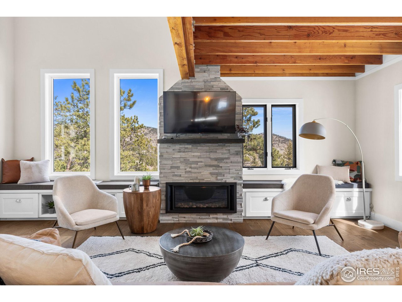 1346 Deer Trail Road Boulder, CO 80302 - Photo 14 of 40 a living room with furniture and a fireplace
