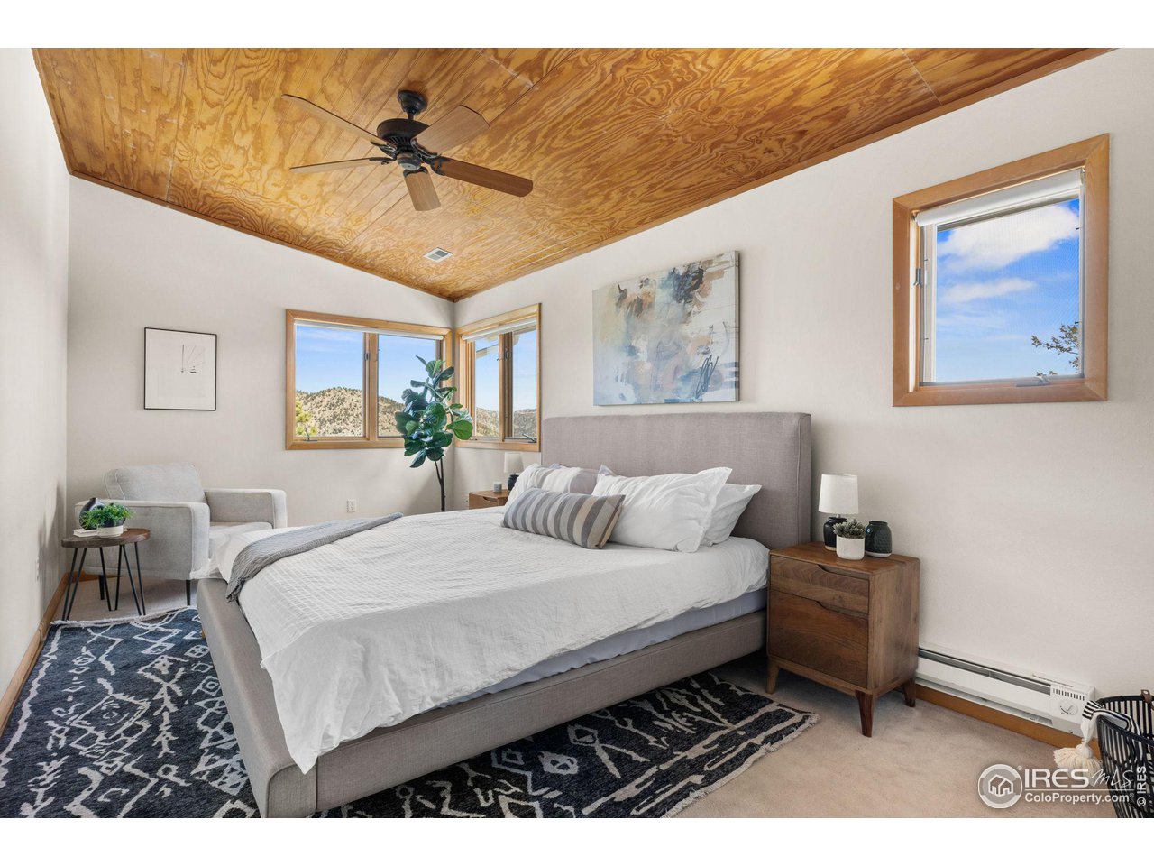 1346 Deer Trail Road Boulder, CO 80302 - Photo 20 of 40 a bedroom with a bed window and wall painting