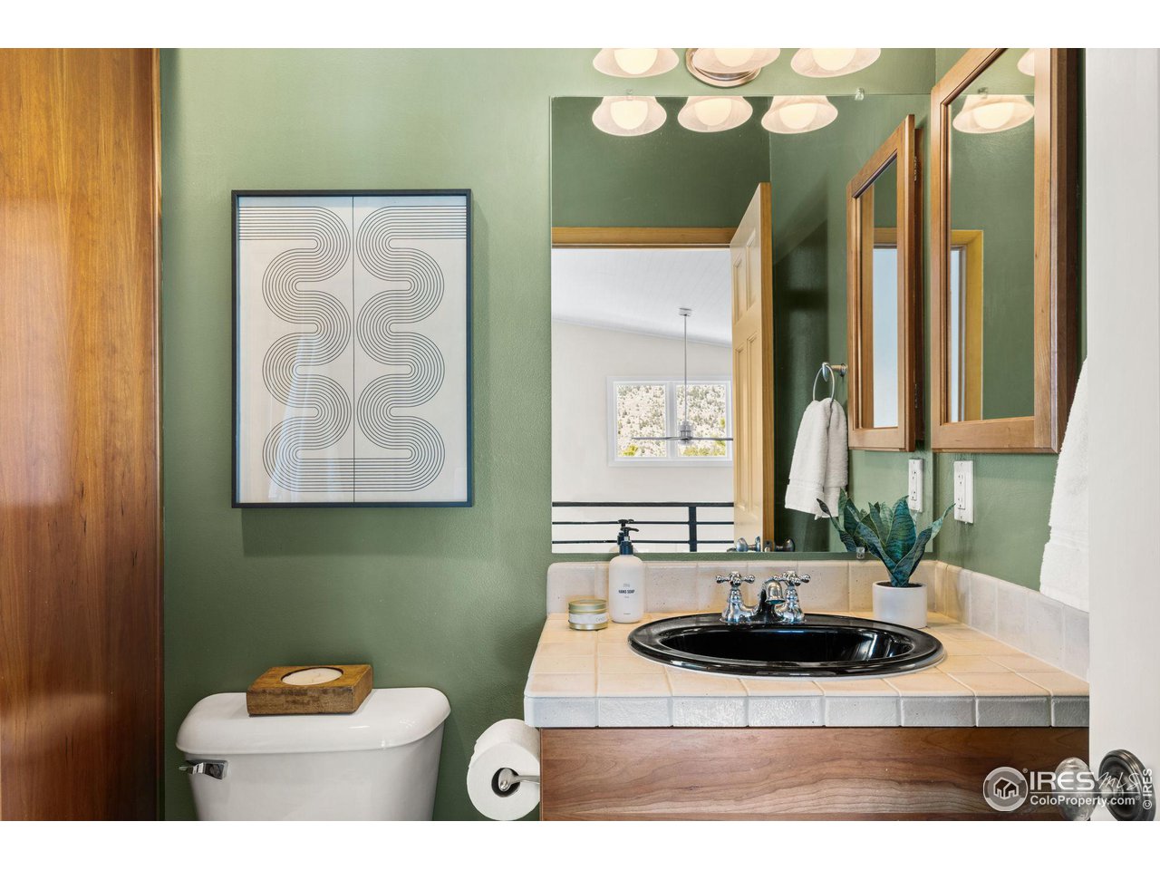 1346 Deer Trail Road Boulder, CO 80302 - Photo 24 of 40 a bathroom with a sink and a mirror