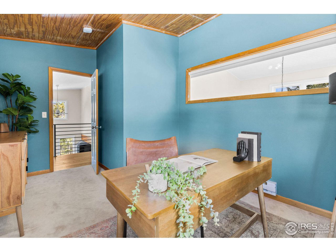 1346 Deer Trail Road Boulder, CO 80302 - Photo 26 of 40 a view of a dining room with furniture and wooden floor