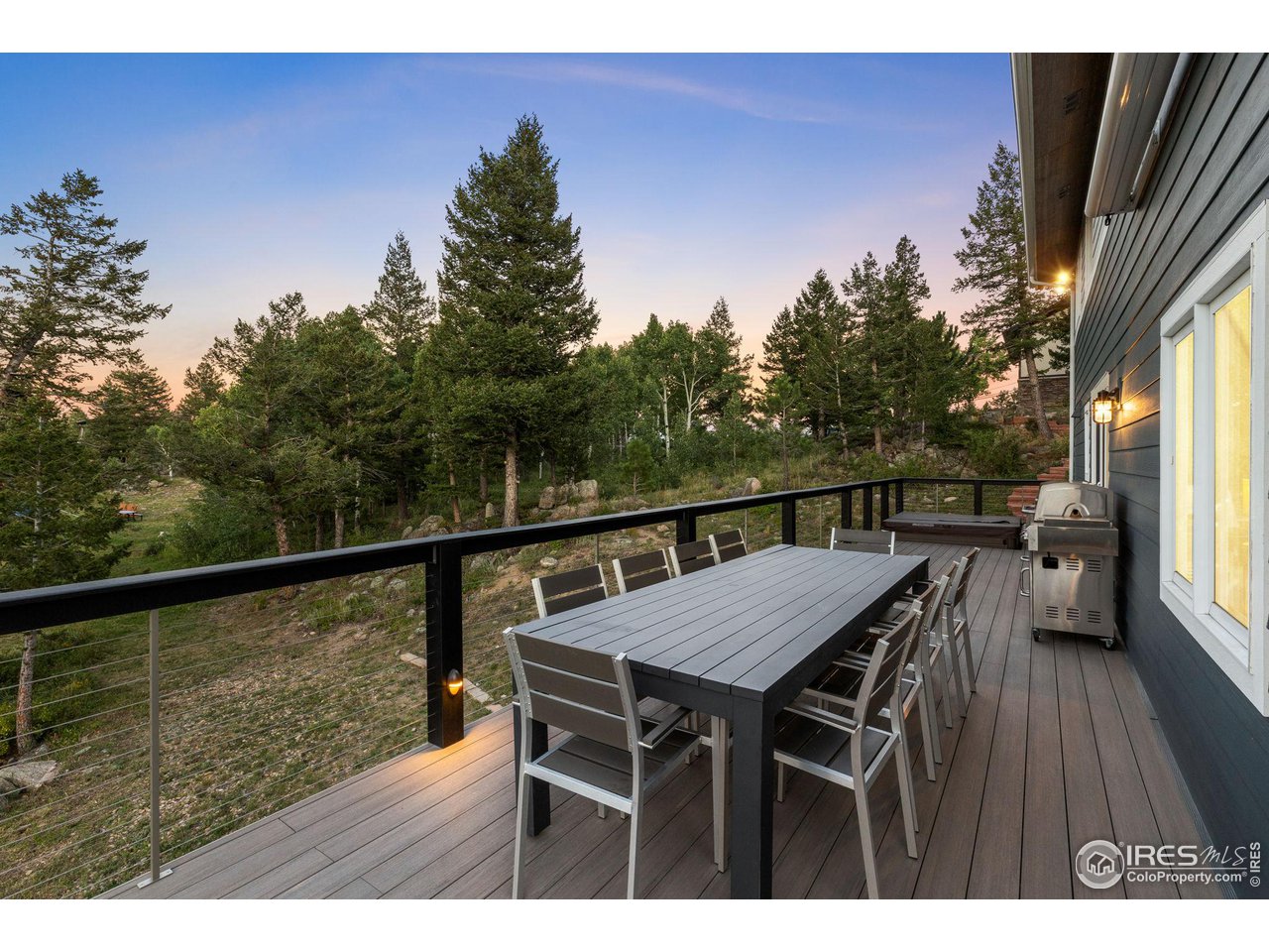 1346 Deer Trail Road Boulder, CO 80302 - Photo 35 of 40 a view of a balcony with furniture and wooden floor