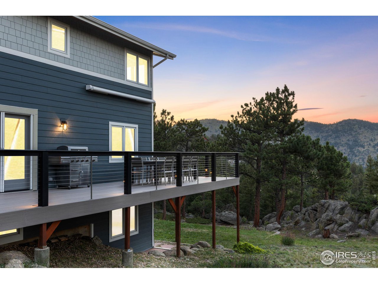 1346 Deer Trail Road Boulder, CO 80302 - Photo 4 of 40 a view of a chairs and table in the balcony