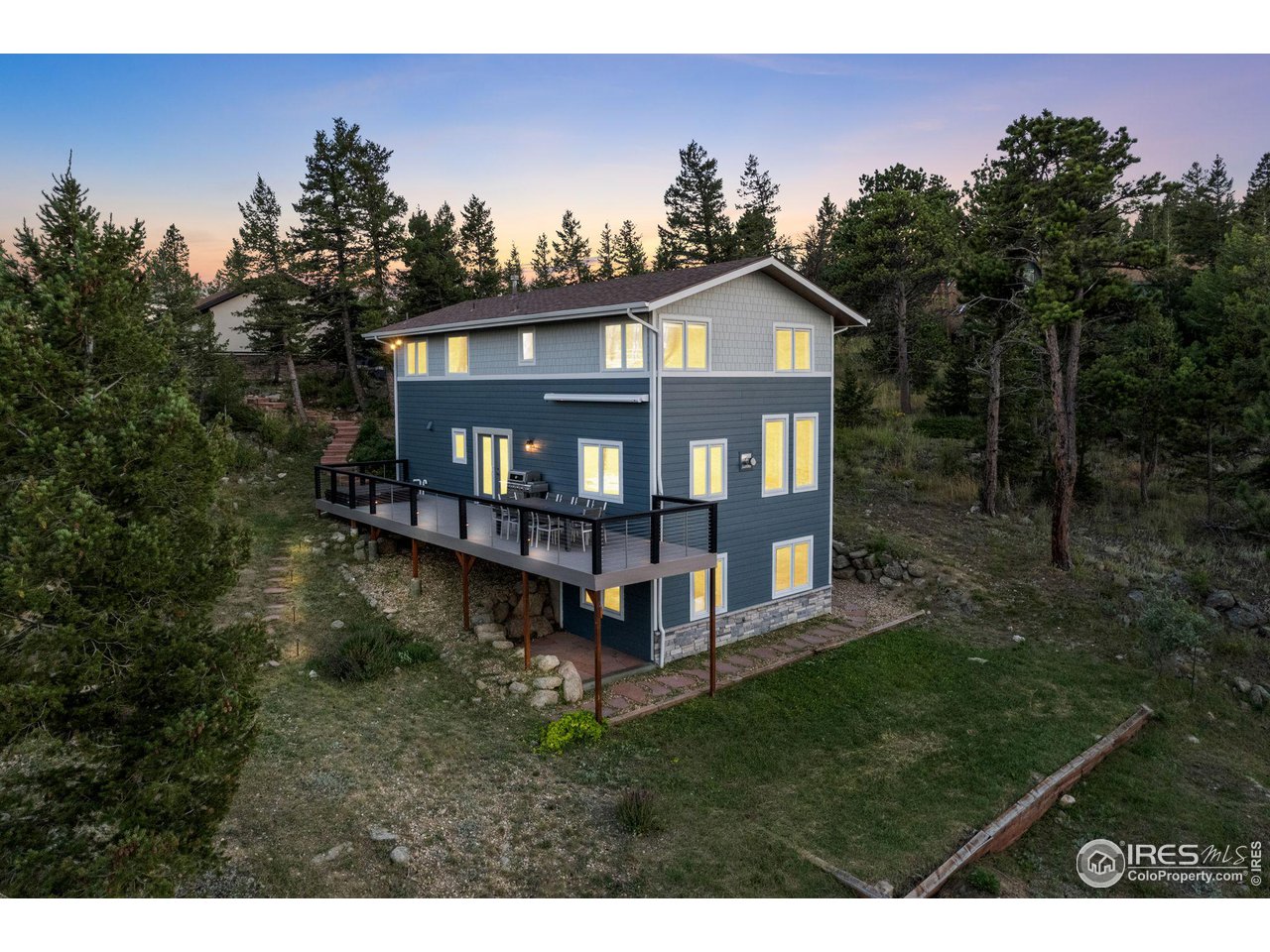 1346 Deer Trail Road Boulder, CO 80302 - Photo 5 of 40 a view of a house with a yard balcony and trees