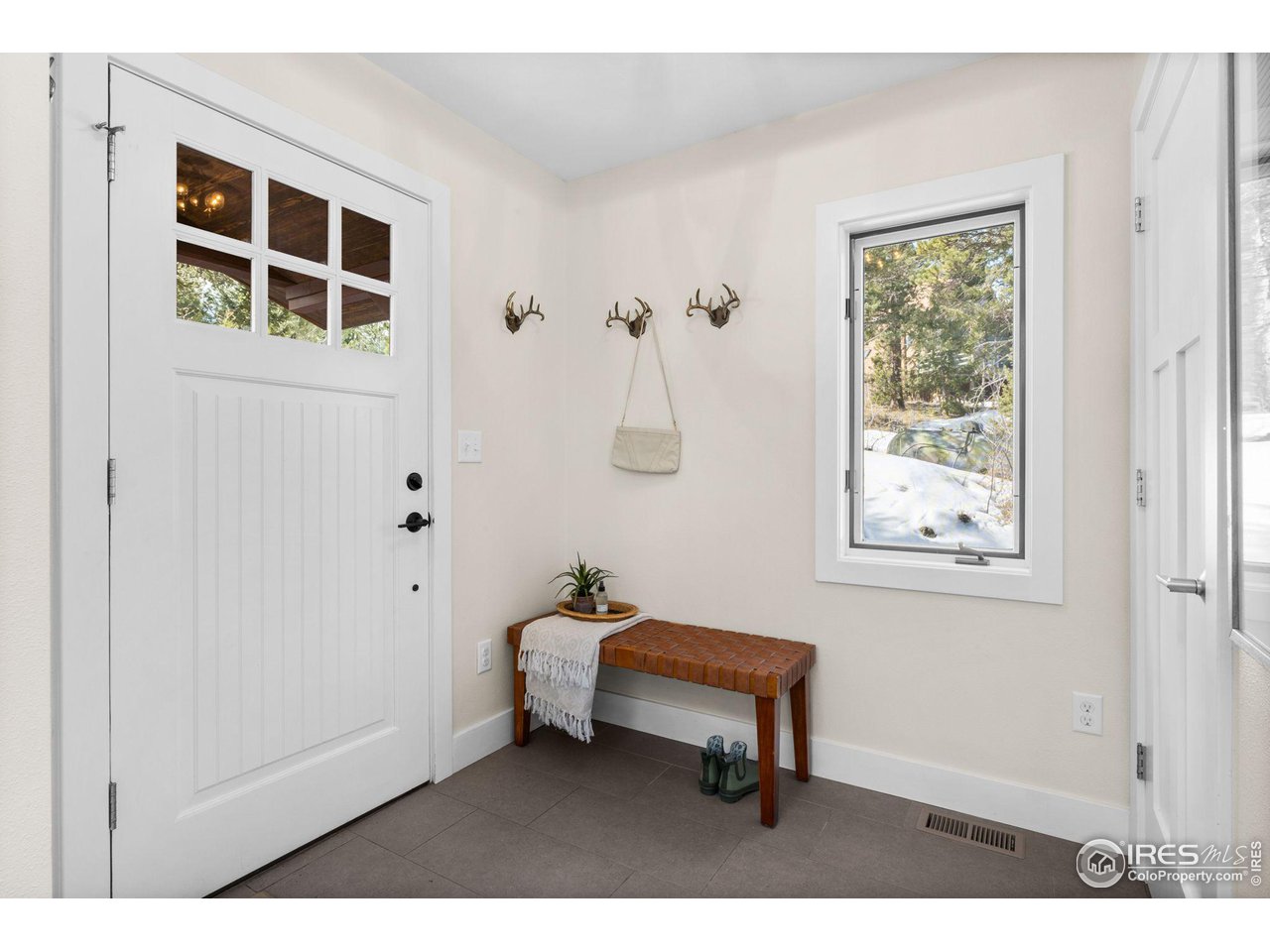1346 Deer Trail Road Boulder, CO 80302 - Photo 6 of 40 a balcony with a bench and a window