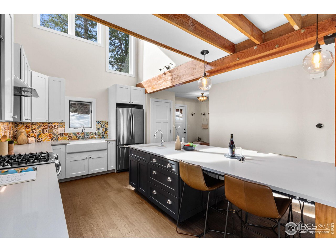 1346 Deer Trail Road Boulder, CO 80302 - Photo 7 of 40 a kitchen with a sink appliances and cabinets