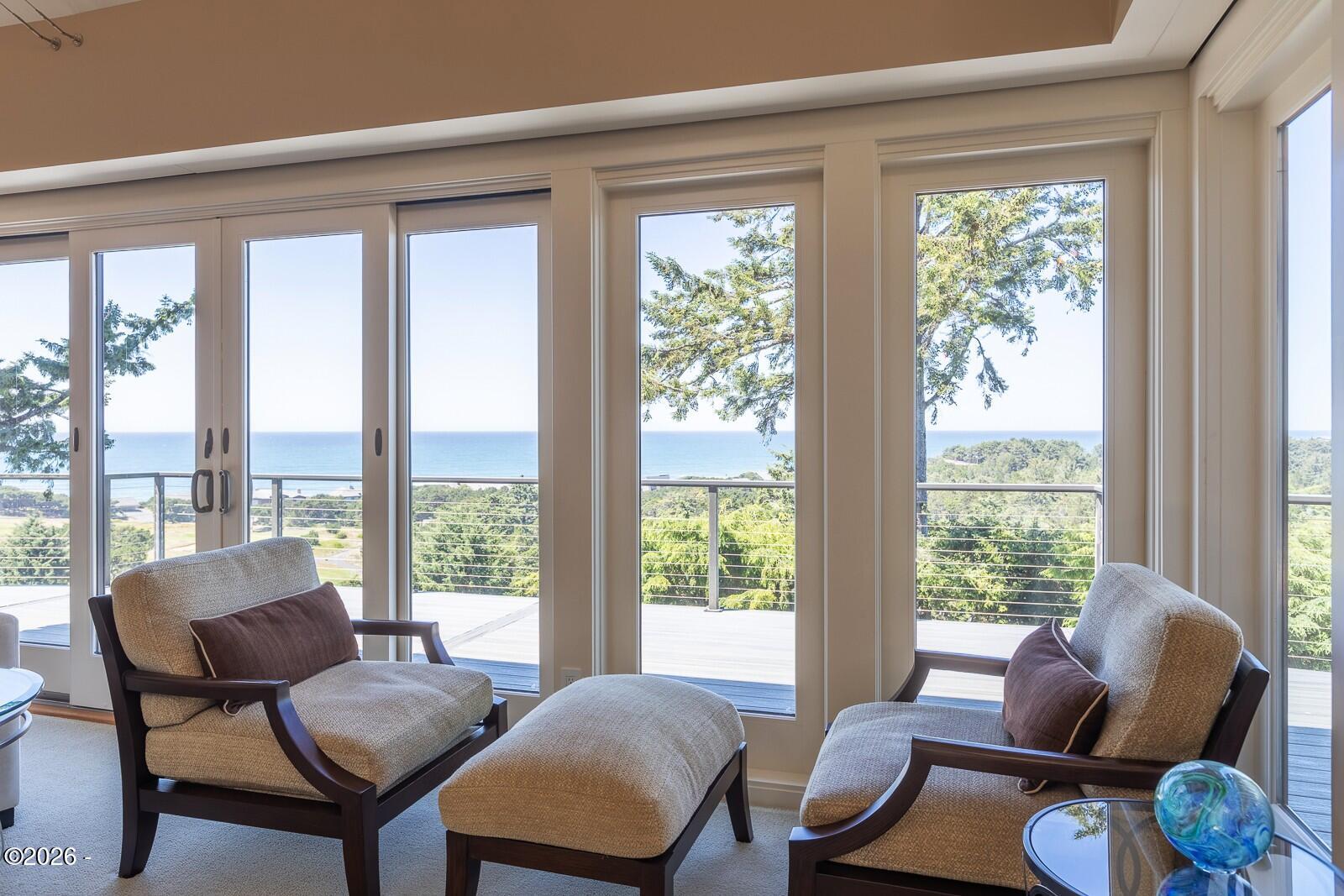 142 East Bay Point Road Gleneden Beach, OR 97388 - Photo 4 of 49 a living room with furniture and windows