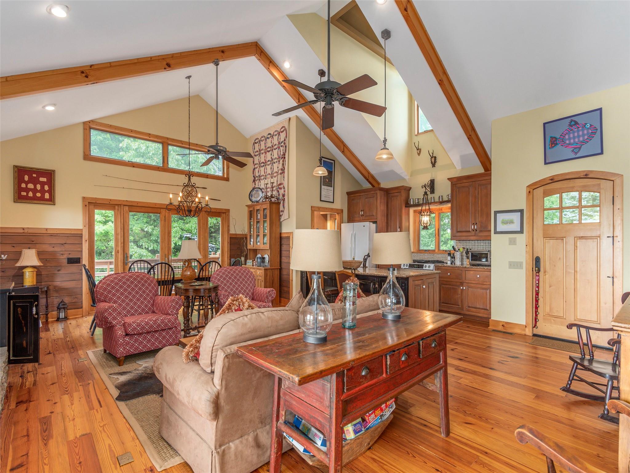 120 Skyridge Drive Clyde, NC 28721 - Photo 11 of 33 a living room with fireplace furniture and a large window