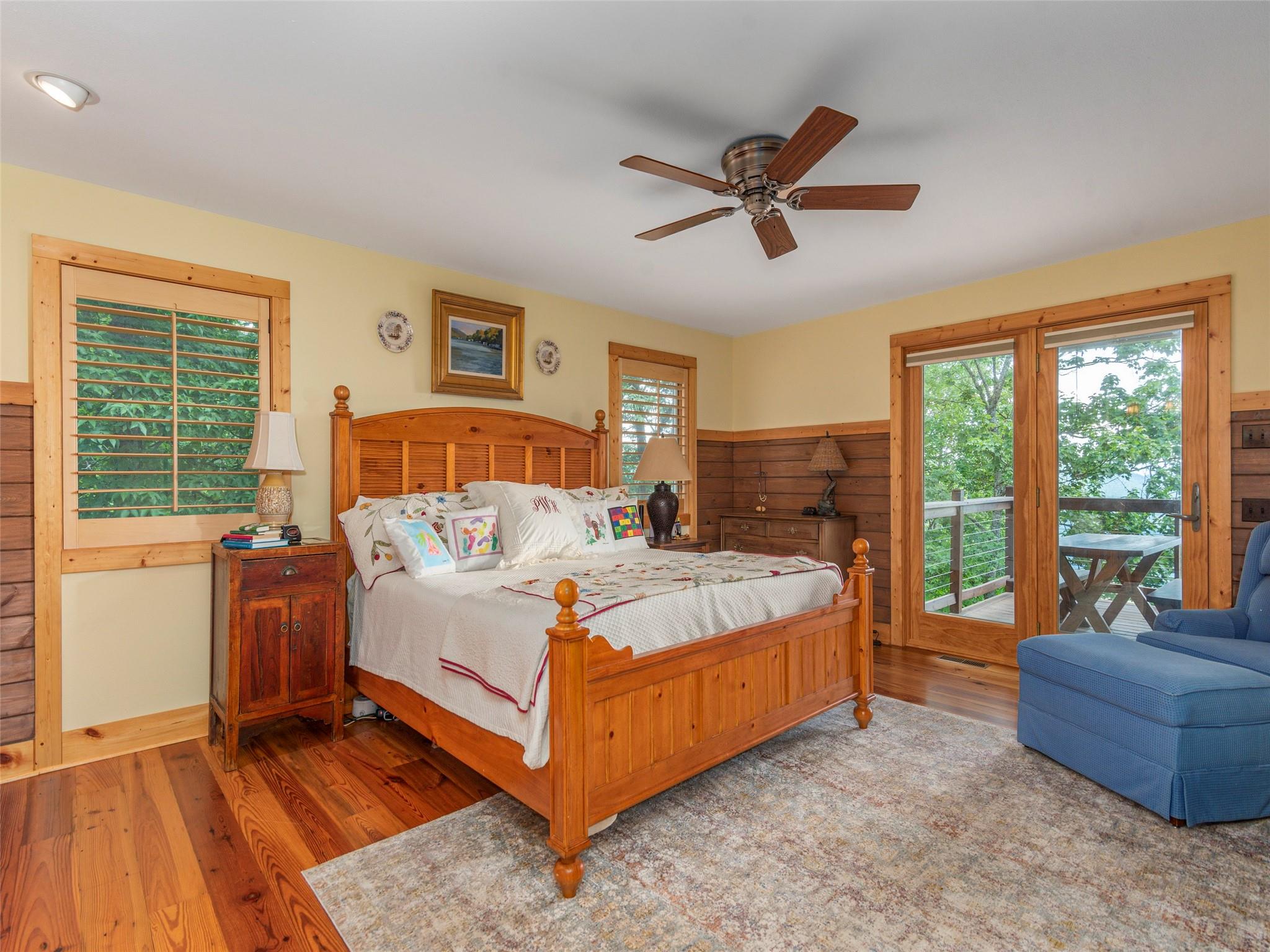 120 Skyridge Drive Clyde, NC 28721 - Photo 18 of 33 a bed sitting in a spacious bedroom next to a window