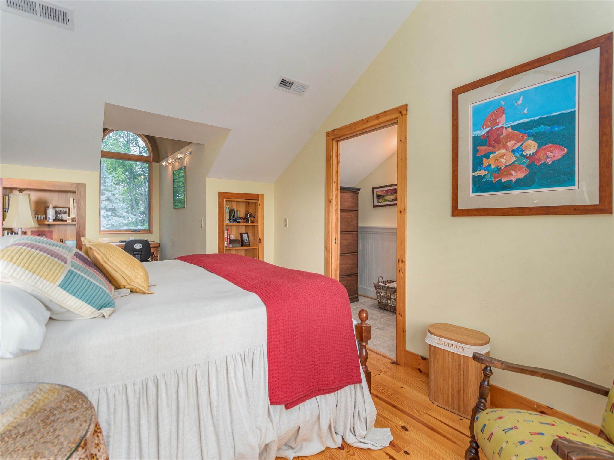 120 Skyridge Drive Clyde, NC 28721 - Photo 20 of 33 a bedroom with a bed and wooden floor