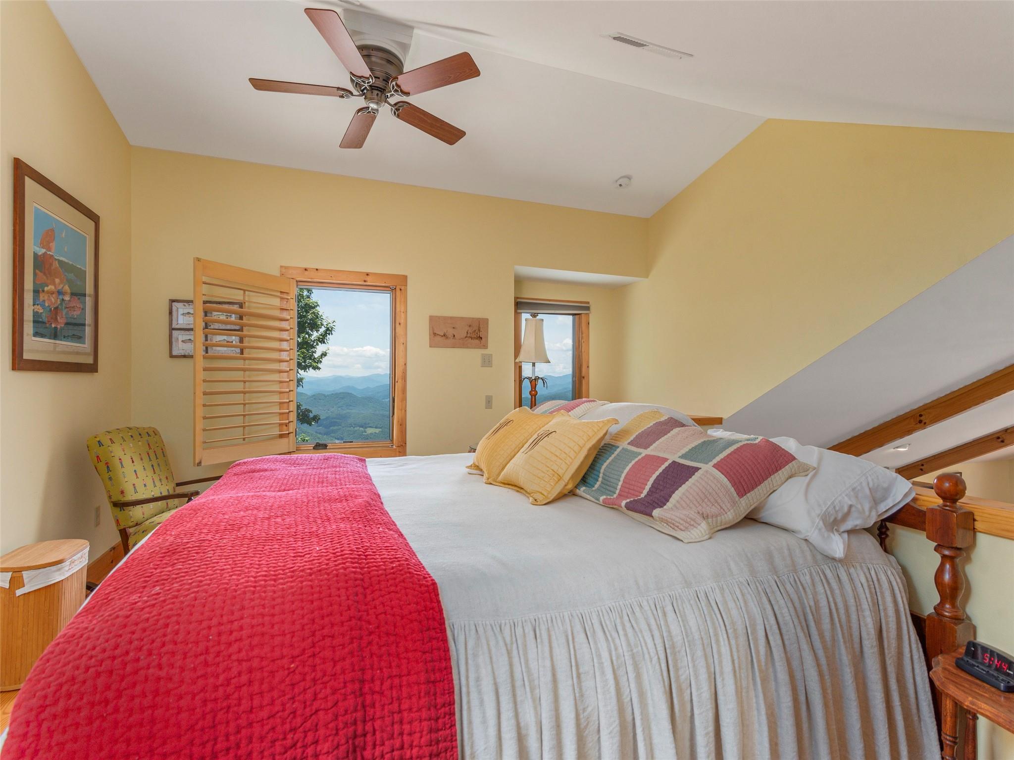 120 Skyridge Drive Clyde, NC 28721 - Photo 21 of 33 a bedroom with a bed and wooden floor