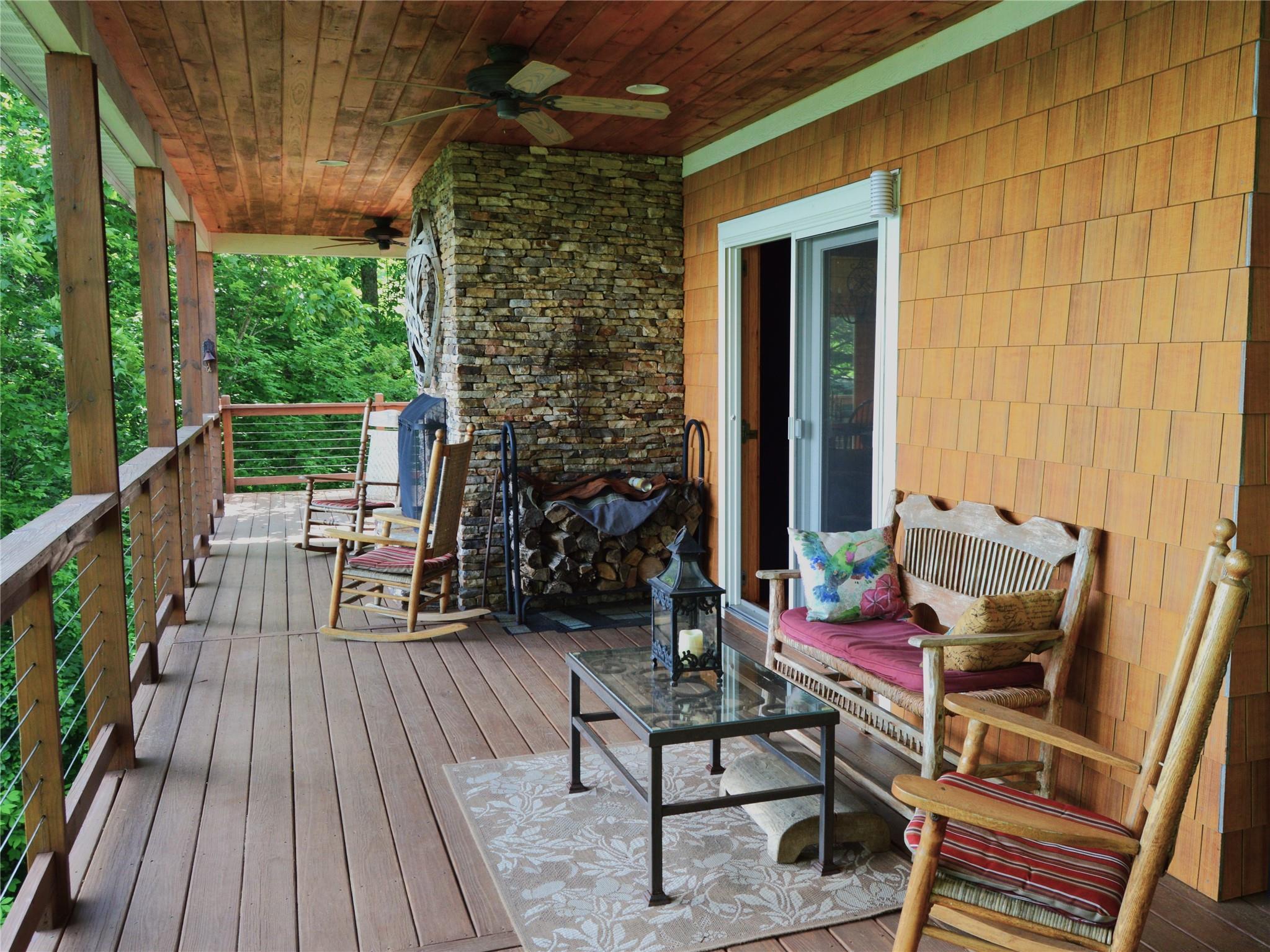 120 Skyridge Drive Clyde, NC 28721 - Photo 28 of 33 a view of balcony with chairs and wooden fence