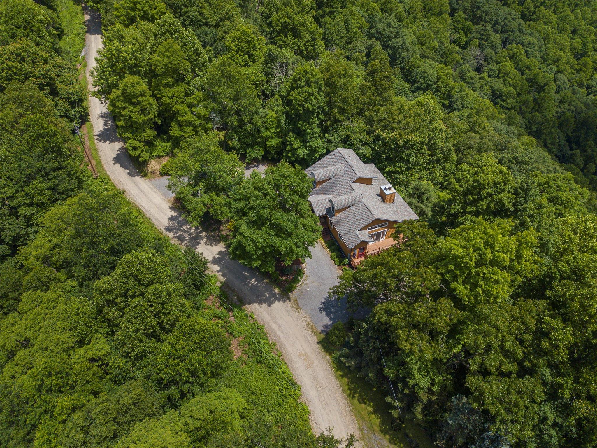 120 Skyridge Drive Clyde, NC 28721 - Photo 33 of 33 an aerial view of a house with a yard