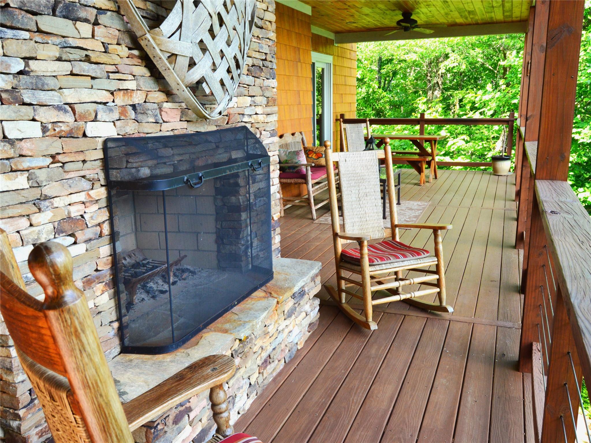 120 Skyridge Drive Clyde, NC 28721 - Photo 5 of 33 a view of balcony with wooden floor and outdoor seating