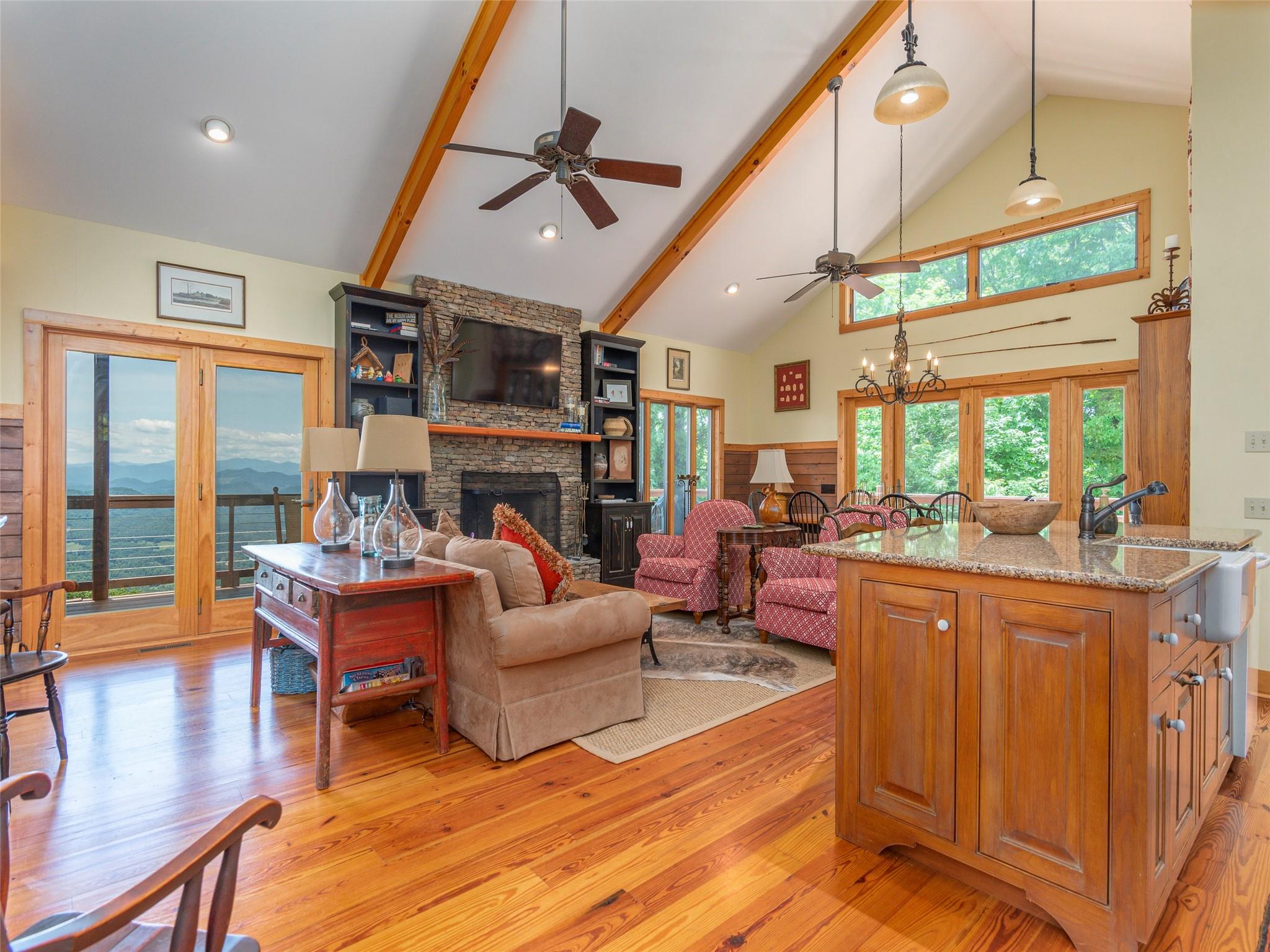 120 Skyridge Drive Clyde, NC 28721 - Photo 7 of 33 a living room with fireplace furniture and a large window