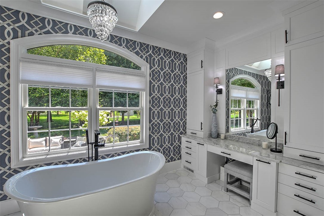 6323 Autumn Ridge Court Decatur, IL 62521 - Photo 20 of 43 a bath tub sitting next to a bathroom sink