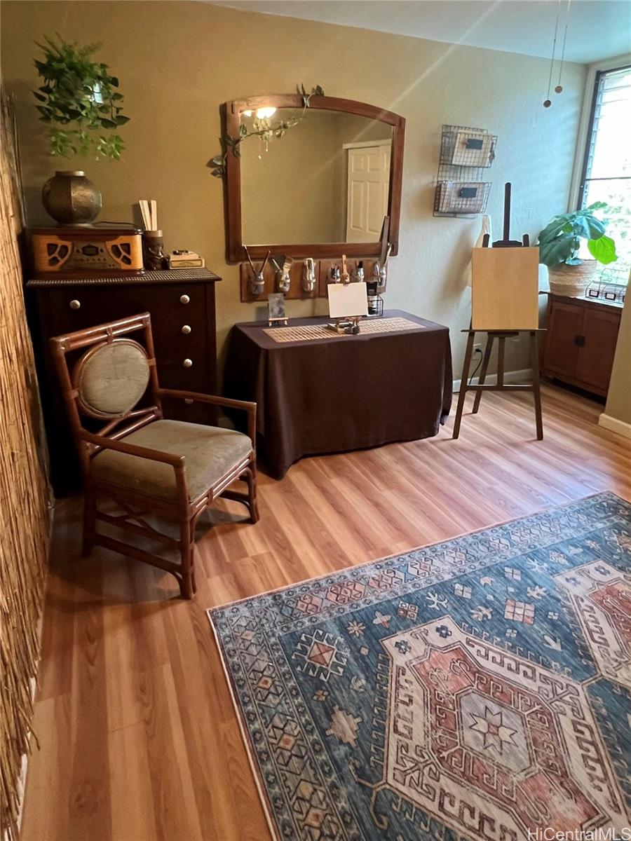 84-664 Ala Mahiku Street, Unit 194C Waianae, HI 96792 - Photo 18 of 25 a bedroom with furniture and wooden floor