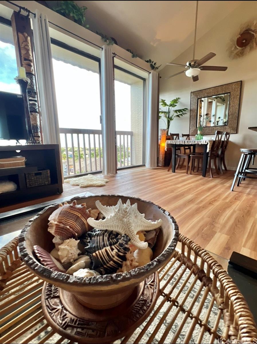 84-664 Ala Mahiku Street, Unit 194C Waianae, HI 96792 - Photo 6 of 25 a living room with furniture and a floor to ceiling window