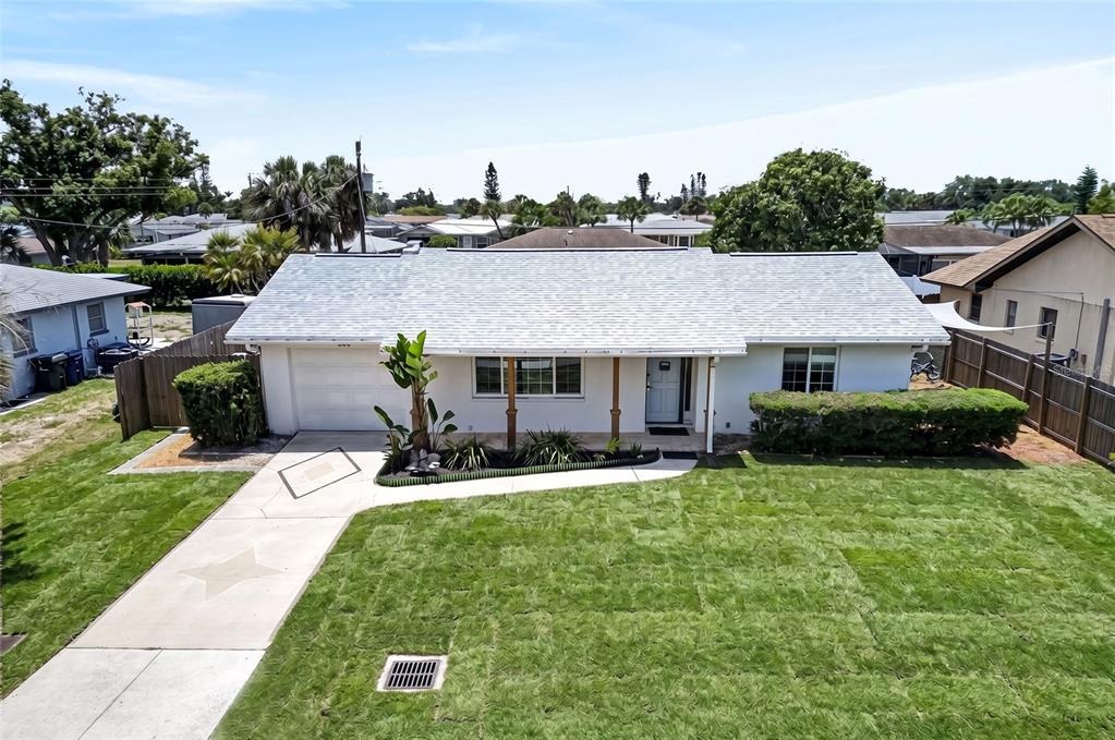 532 Center Road Venice, FL 34285 - Photo 7 of 68 a aerial view of a house with a yard patio and swimming pool