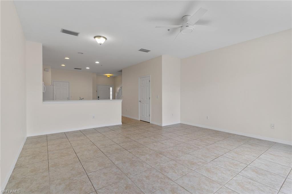 16235 Ravina Way Naples, FL 34110 - Photo 6 of 18 Tile flooring, recessed lighting, ceiling fan, and a half-wall partition