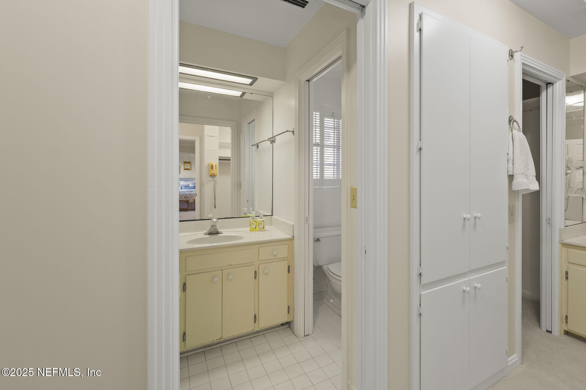 12550 Mandarin Road Jacksonville, FL 32223 - Photo 25 of 49 a bathroom with a double vanity sink and mirror