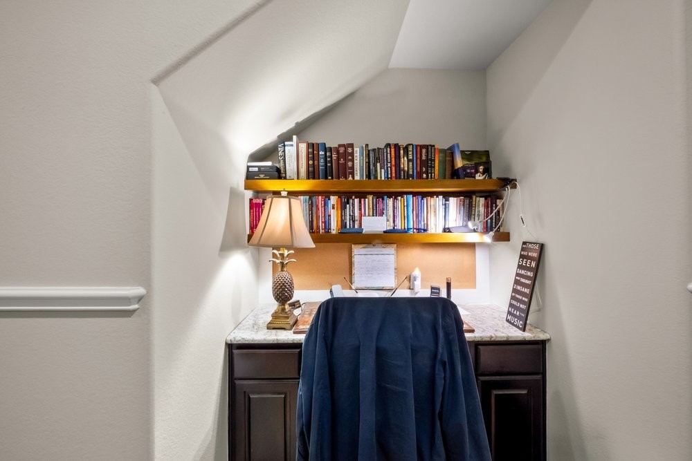 1589 Cool Spring Way Austin, TX 78737 - Photo 17 of 32 A built-in desk is tucked into the spacious home office.