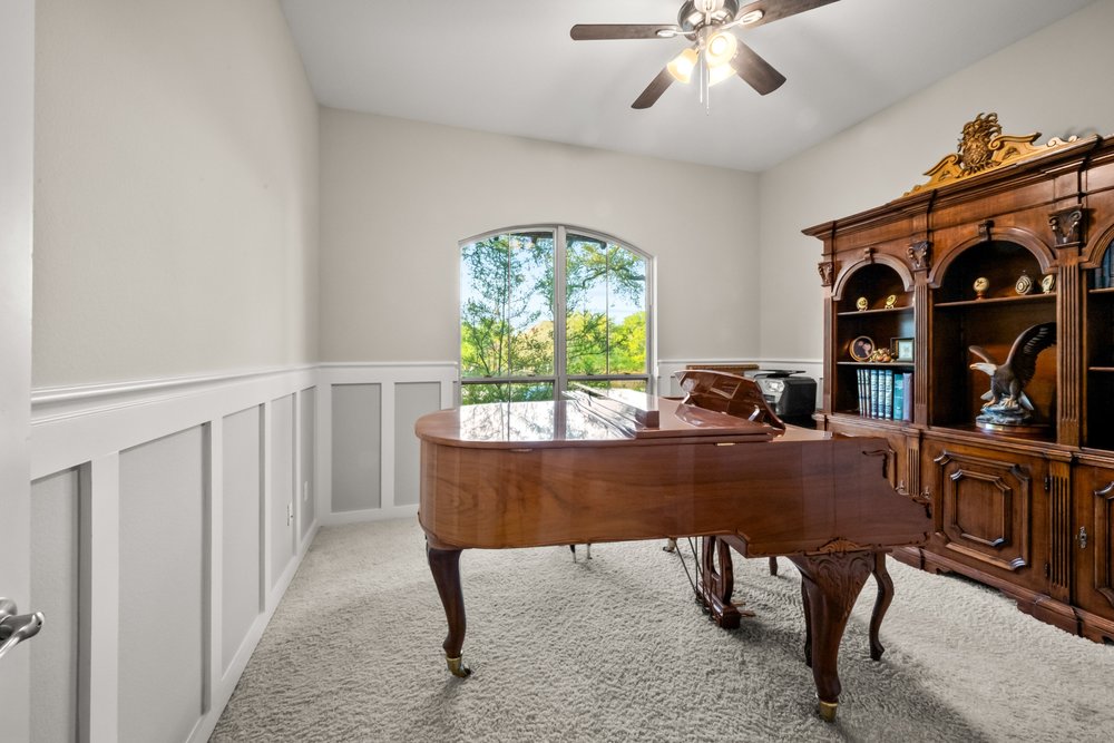 1589 Cool Spring Way Austin, TX 78737 - Photo 19 of 32 Guest bedroom 1 is currently being used as a music room.