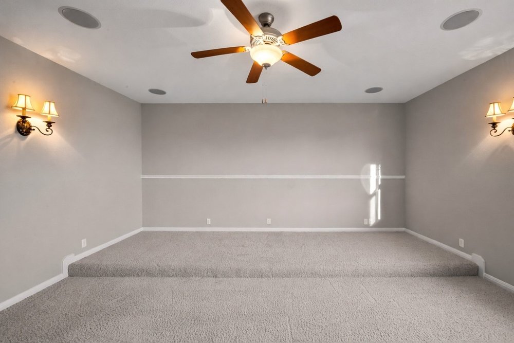 1589 Cool Spring Way Austin, TX 78737 - Photo 22 of 32 The large media room features built-in speakers and tiered seating area. A media closet is located in the adjacent half-bath.