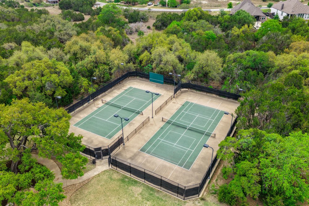 1589 Cool Spring Way Austin, TX 78737 - Photo 32 of 32 Tennis courts are a popular amenity in the Highpointe neighborhood.