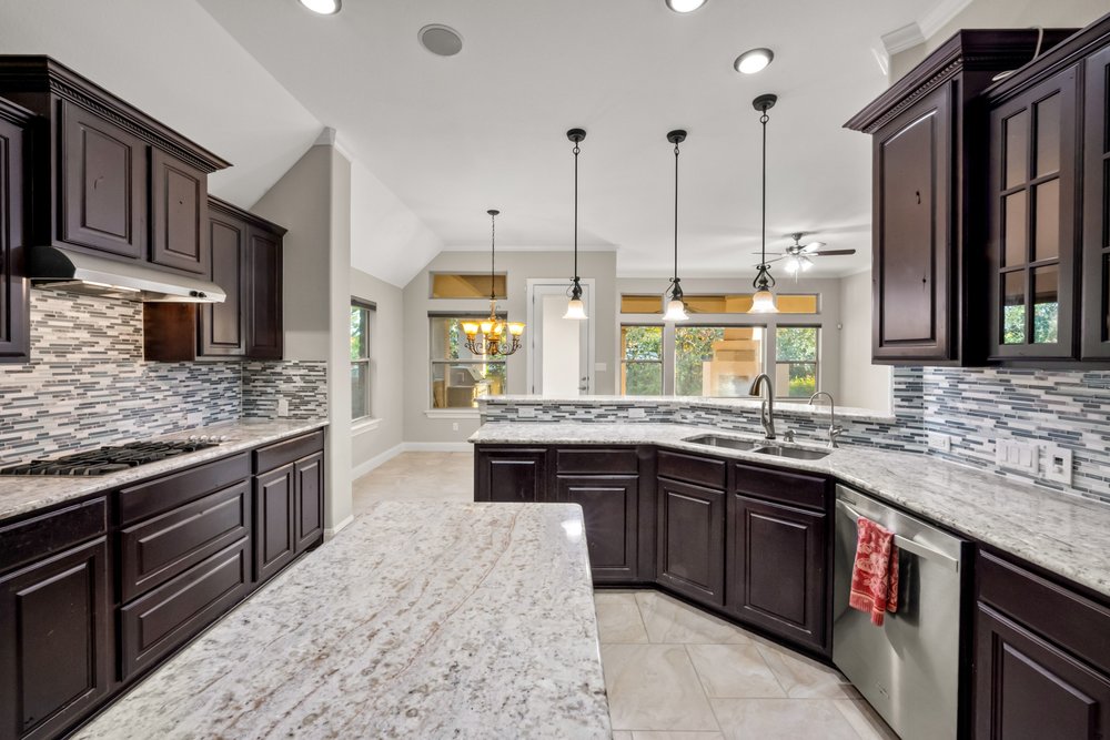 1589 Cool Spring Way Austin, TX 78737 - Photo 5 of 32 Spacious kitchen with abundant counter space and center island.