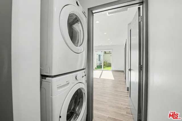 a view of a hallway with washer and dryer