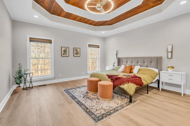 a view of a room with wooden floor