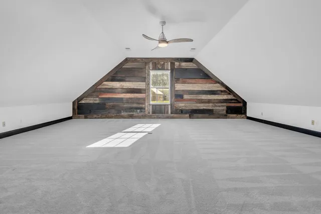 a bathroom with a sink mirror vanity and toilet