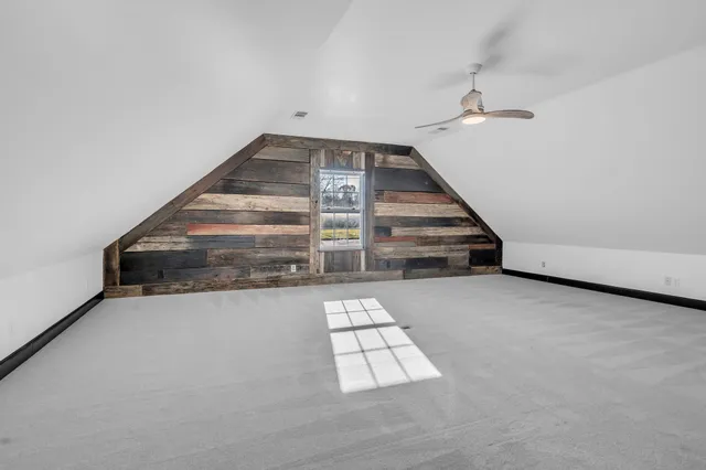 a big room with closet and windows