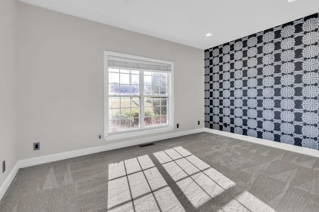 a view of empty room with windows