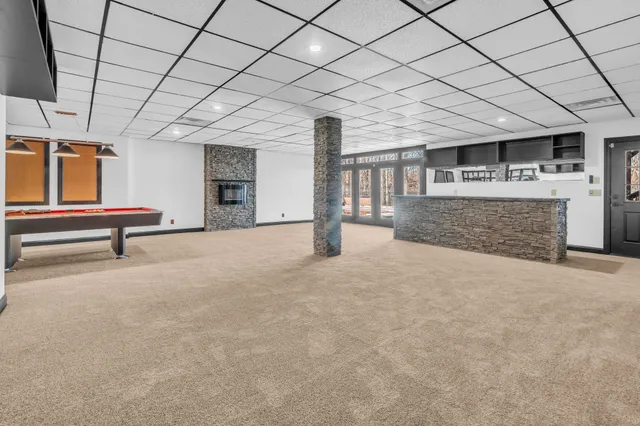 a bathroom with a sink toilet a mirror and shower