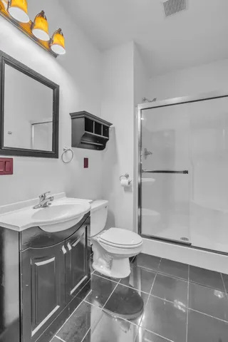 a view of a big house with a big yard and large trees